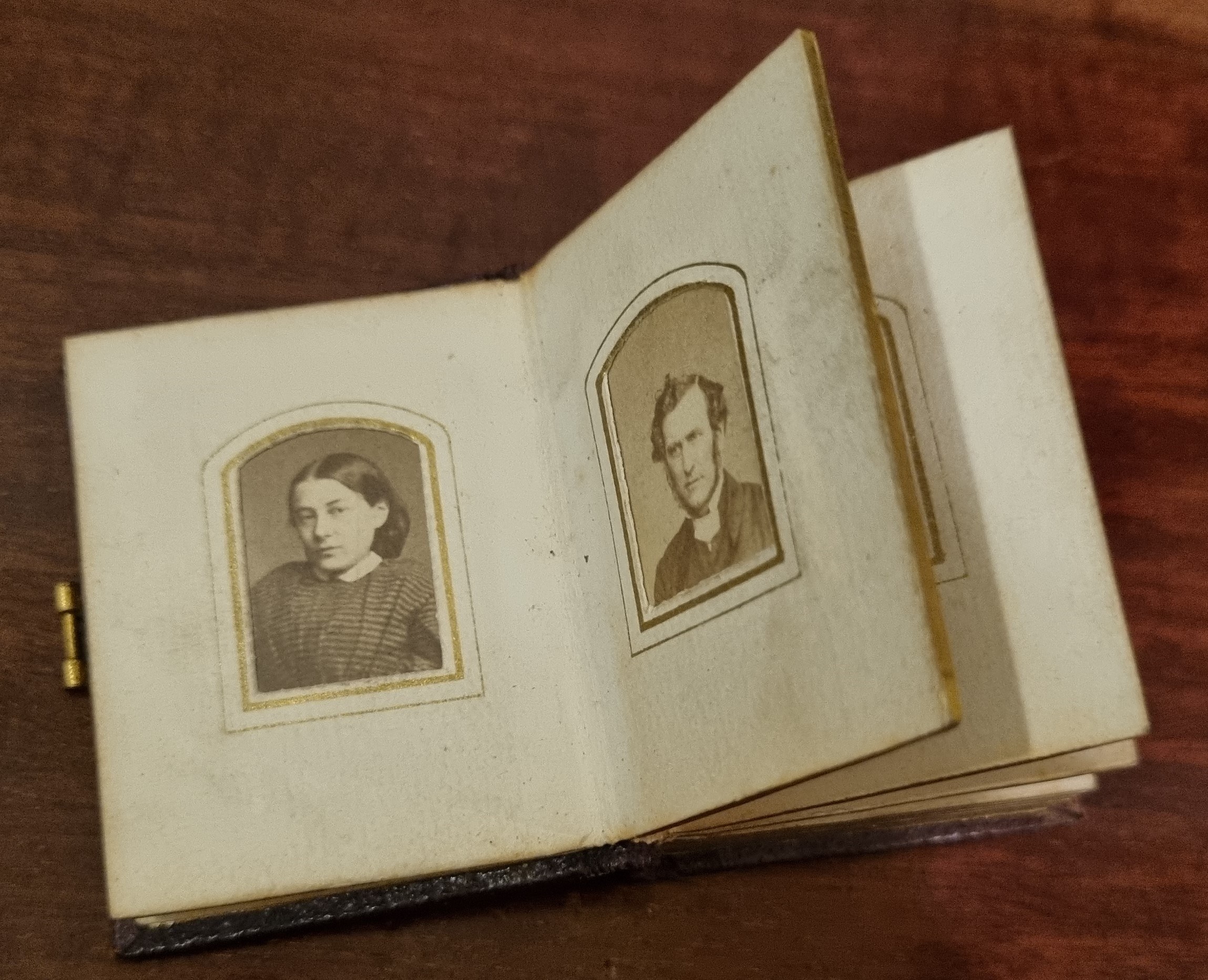 Miniature photo album open